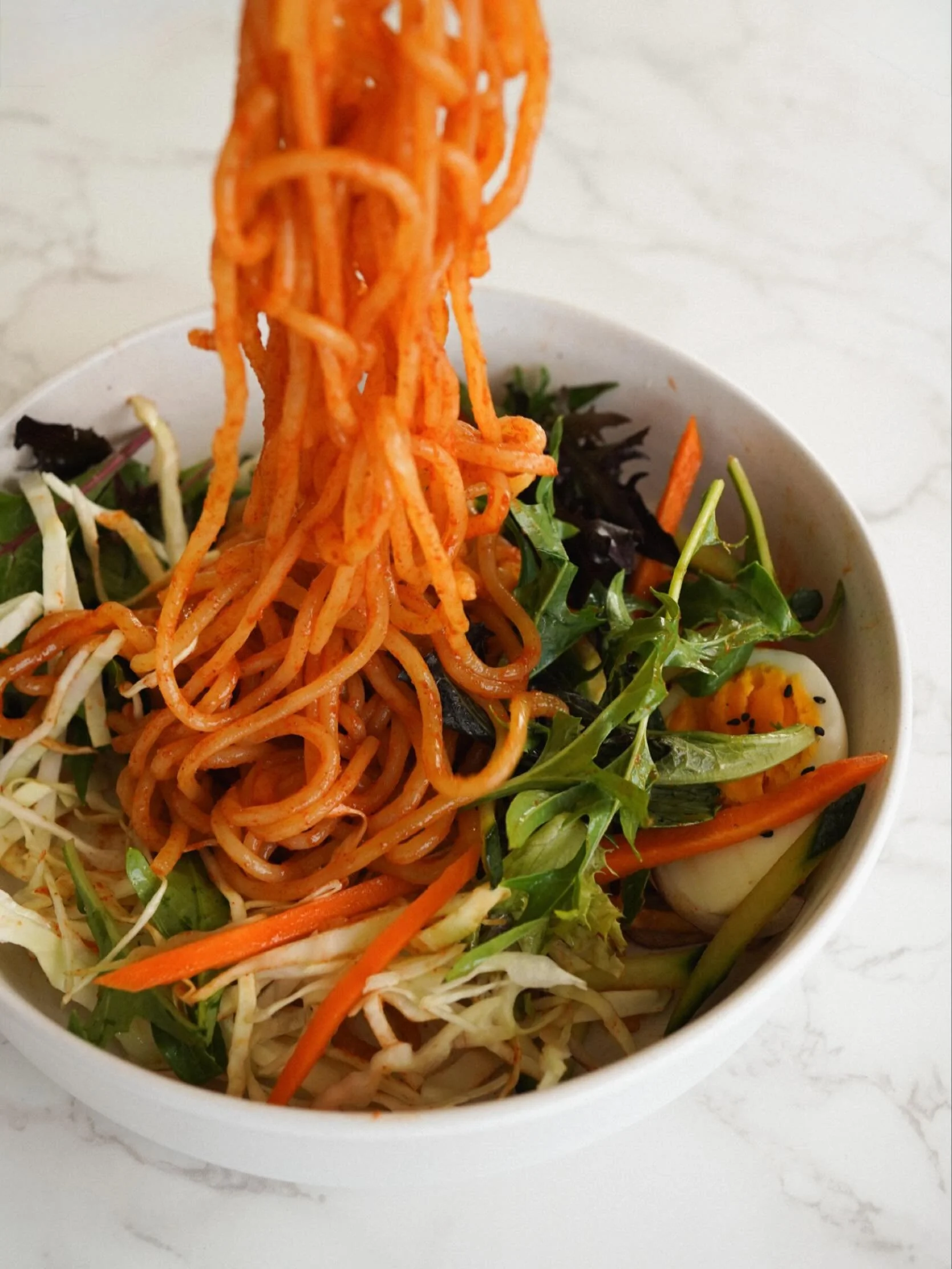 Spicy, chewy, sweet &amp; sour &mdash; this bowl of Jjolmyeon hits every craving! 
Cold noodles that cool you down while turning up the flavour.
Perfect for hot summer days when you want something refreshing yet satisfying. 😋

Available on our dinne