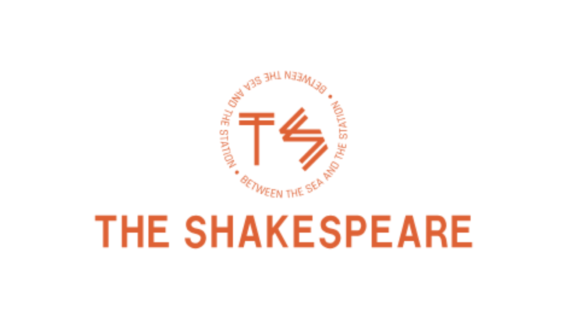 Logo of The Shakespeare with a circular emblem containing stylized letters T and S and the text 'Shakespeare the show the show' in a circular pattern around it, all in orange and black.