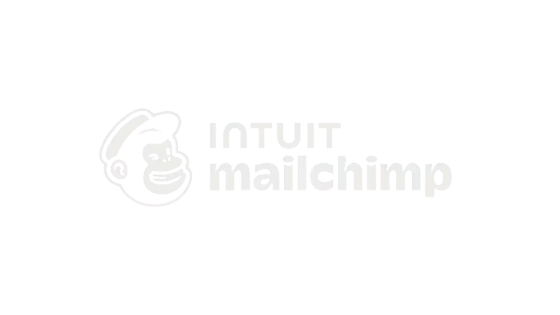 Mailchimp logo with the Mailchimp mascot, a smiling chimpanzee wearing a hat, and the text "IntroMailchimp" in grey on a black background.