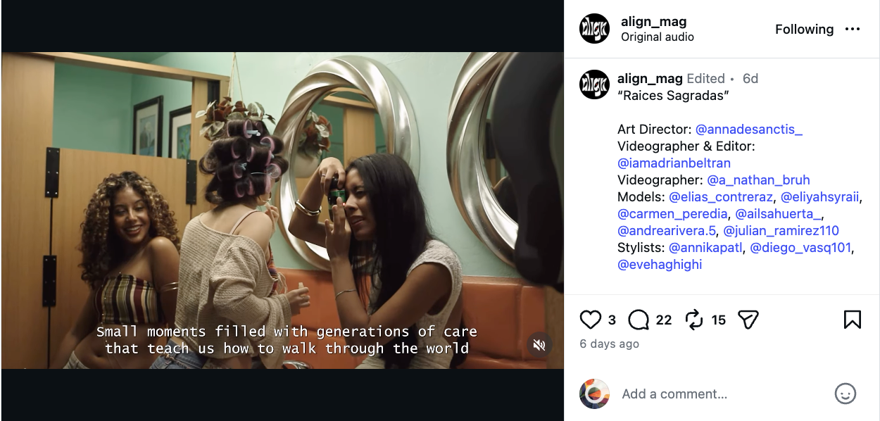 Three young women sitting in a room, one with curly hair smiling, one with rollers in her hair, and another with straight black hair talking on the phone, with a mirror and wooden panels in the background.