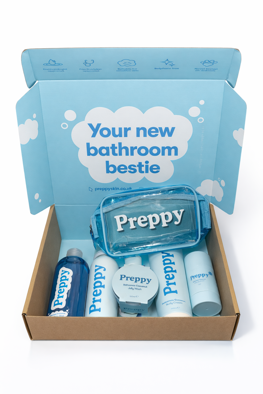 A bathroom product set from Preppy in blue and white, including bottles, a jar, a body cream, and a clear plastic bag, displayed in a brown box with a blue interior that says "Your new bathroom bestie."
