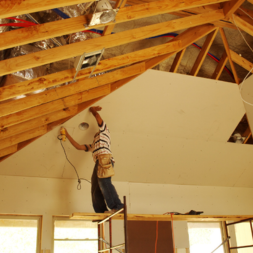 Drywall installation on a vaulted ceiling in a Denver residential home during interior renovation