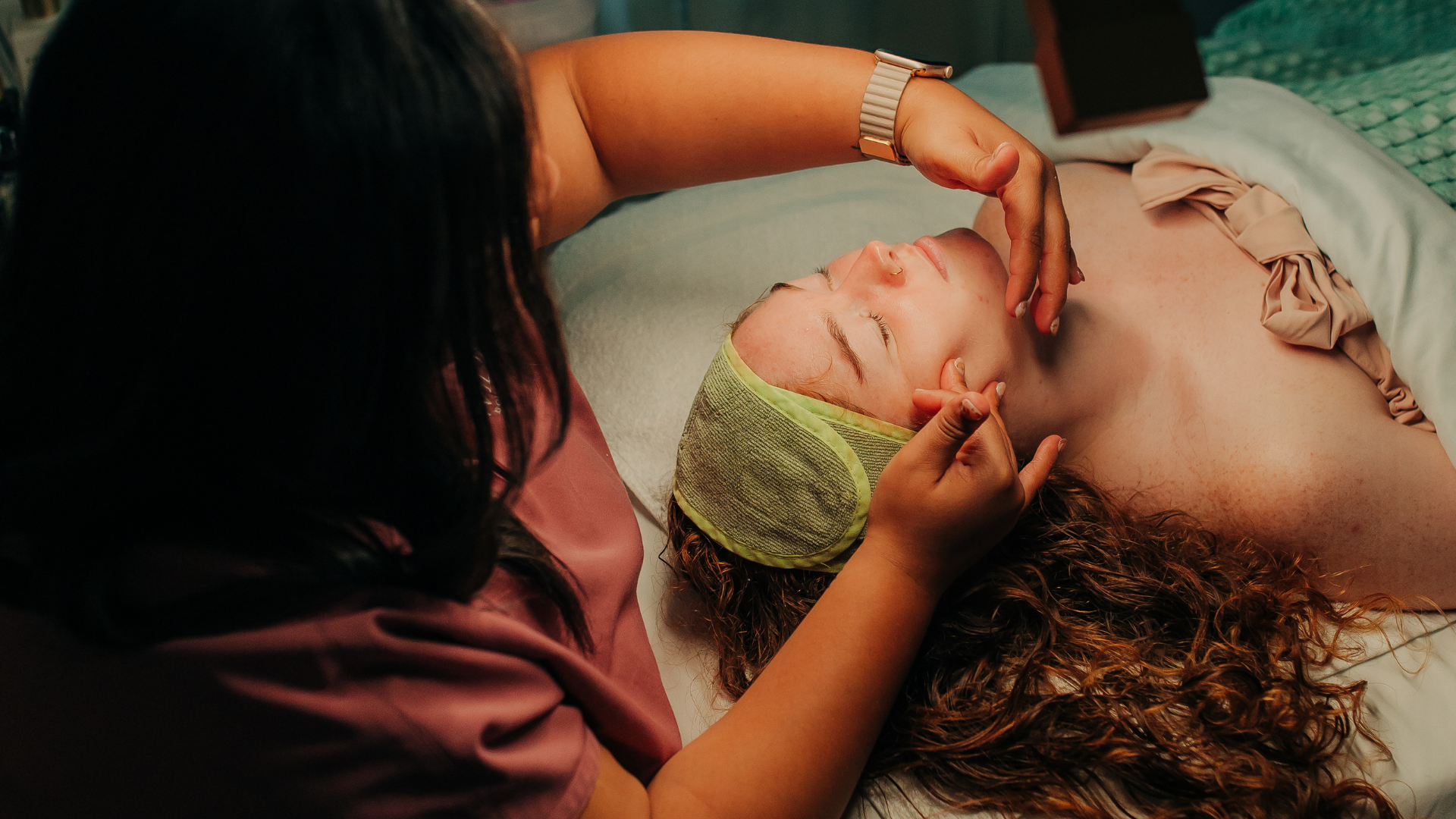 woman receiving a facial treatment in a spa setting