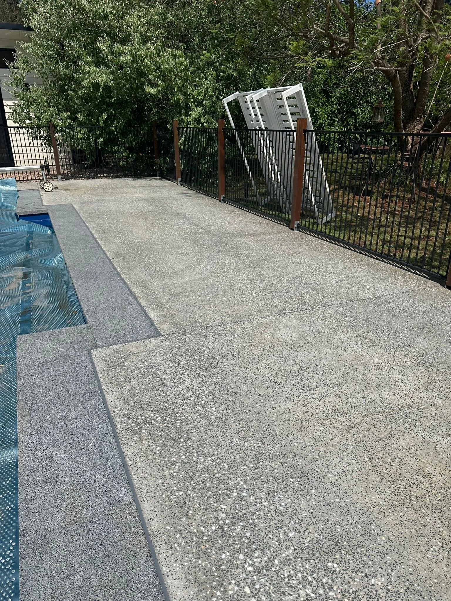 Pool area that has been Washworked to removed red dirt staining and had the full sealing and protect treatment