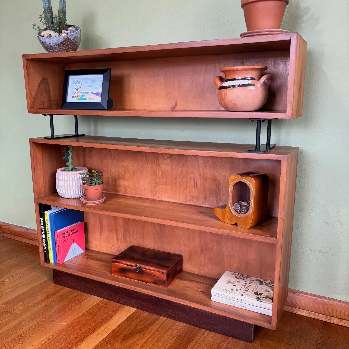 *FOR SALE* Refinished solid wooden bookshelf with black metal supports. 

The refresh:
✨ Sanded, stained, and sealed
✨ Black metal supports for added structure 
✨ Open cubby design for flexible storage

Dimensions:
40.5&rdquo;Height
9&rdquo;Deep
43&r