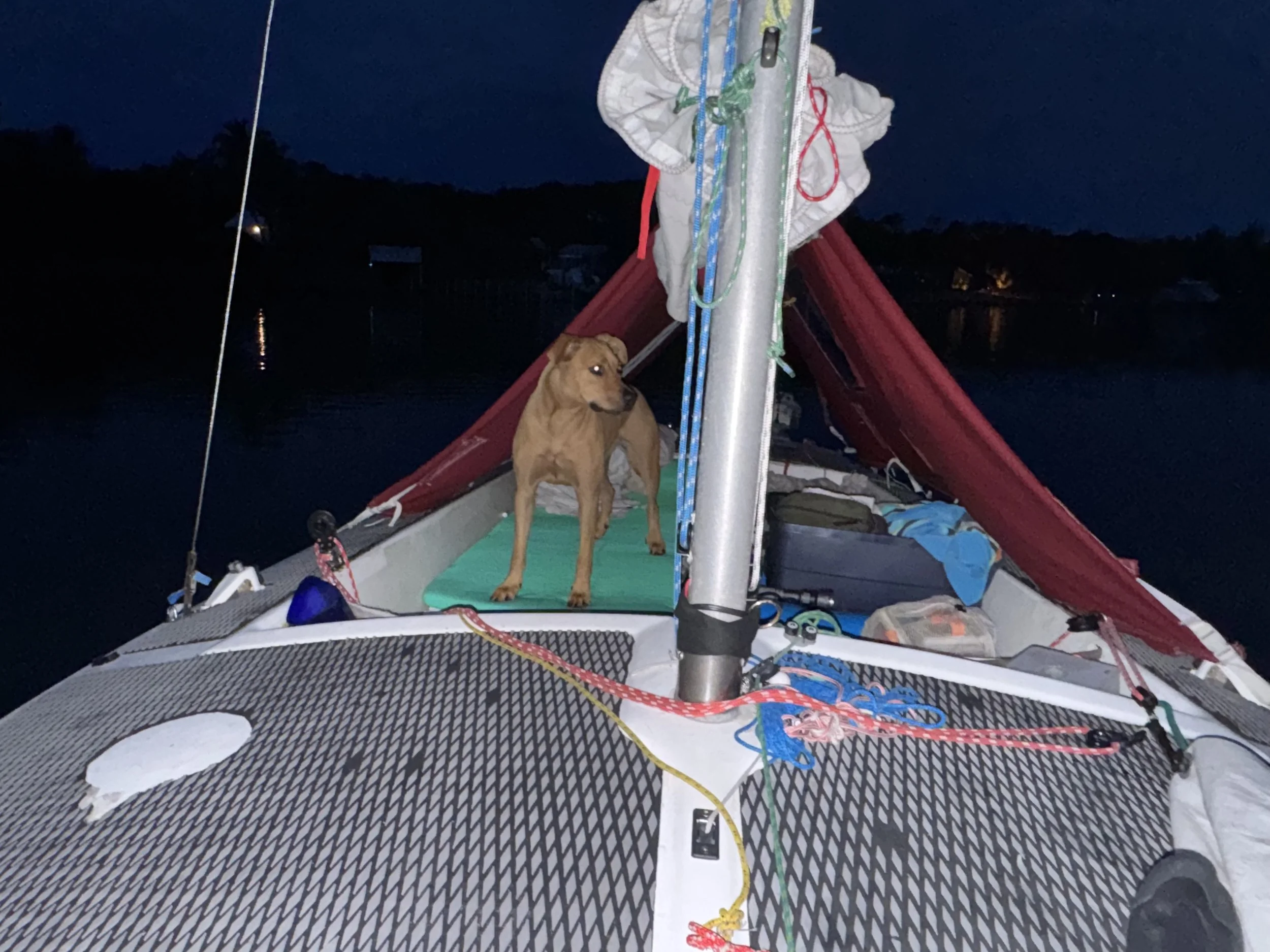 Gal under the boom tent on a sail/camping trip to Spanish Point in Little Sarasota Bay