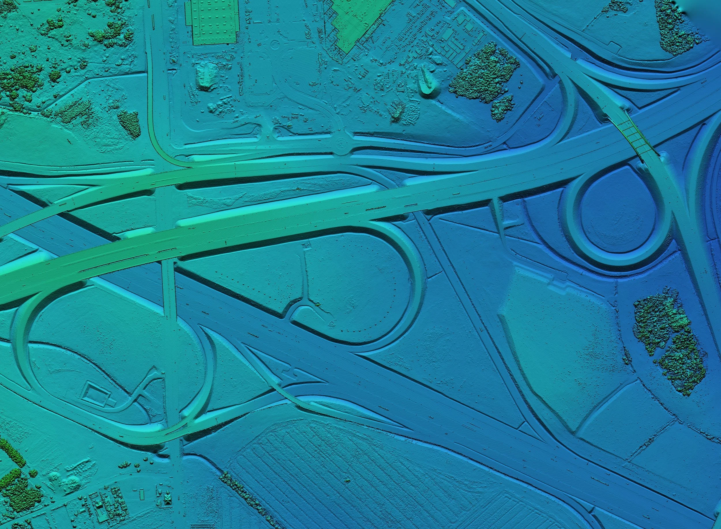 Color-coded 3D map of a highway interchange with roads, overpasses, and surrounding landscape.