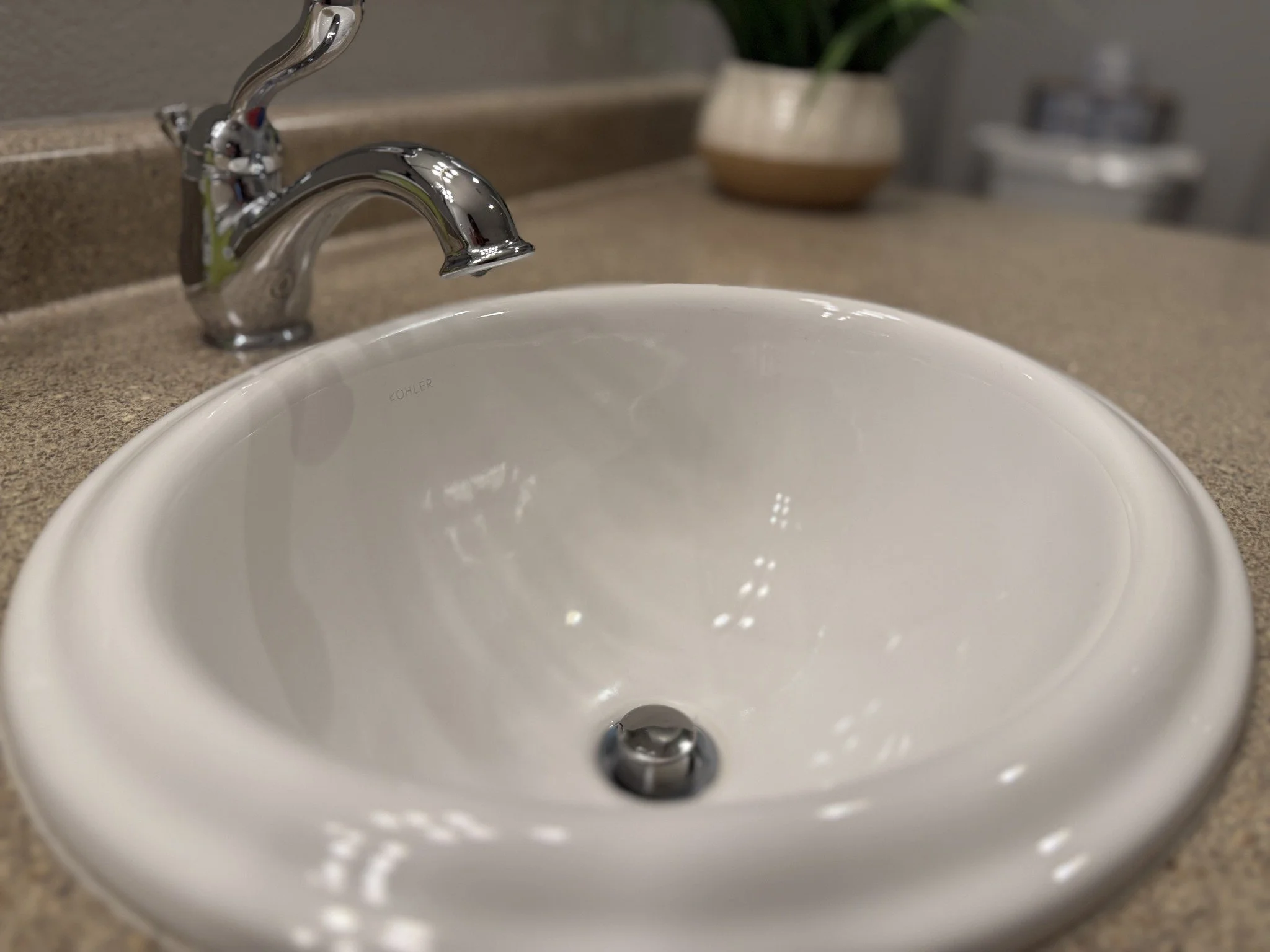 a freshly cleaned bathroom sink done by Cleaning Quality