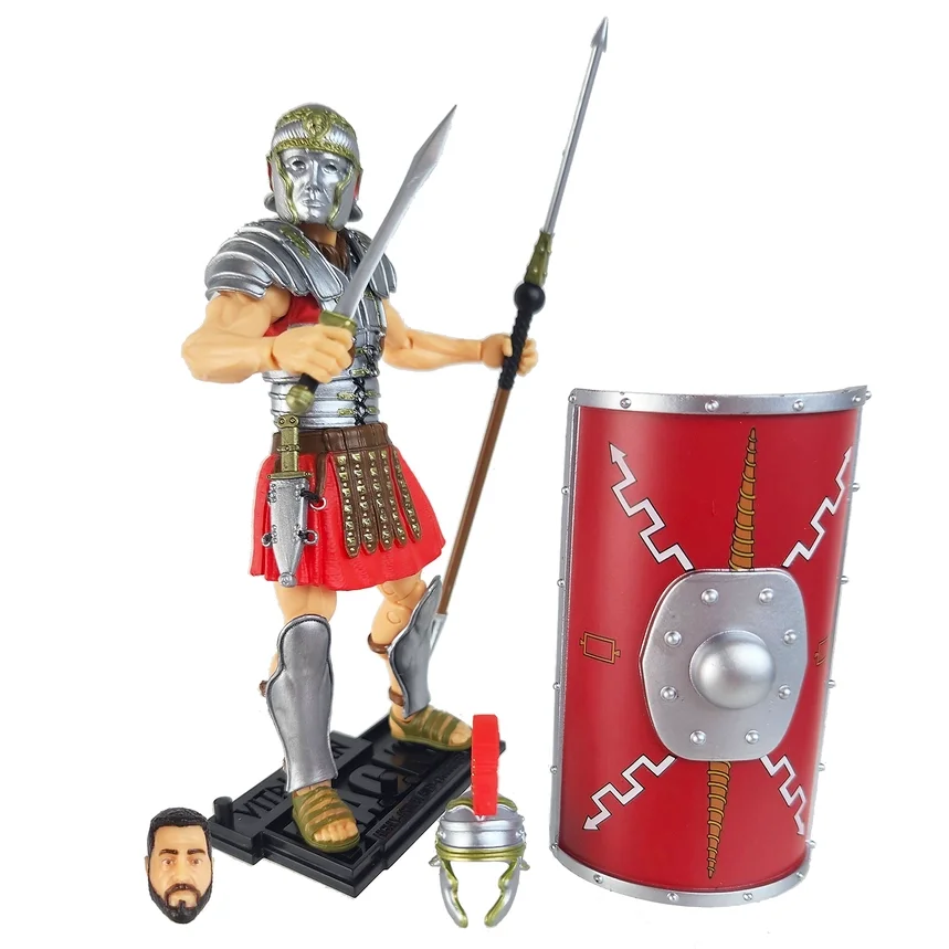 Action figure of a Roman soldier with a silver helmet, armor, red skirt, and sandals, holding a spear and shield, with a small bust of a man's face and a candle in front.
