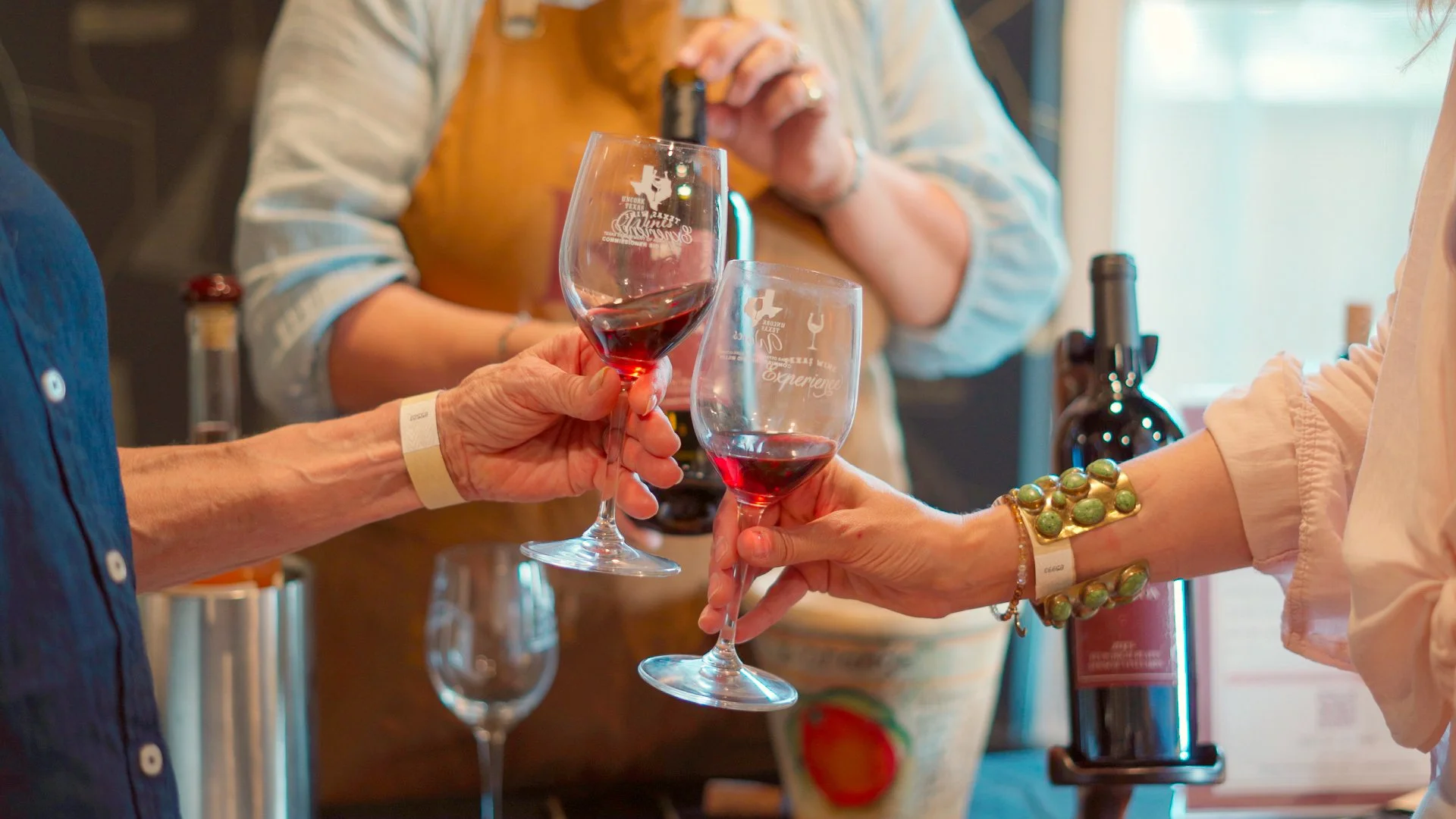  Guests sampling wines from Texas wineries during a curated tasting experience at Guad Haus. 