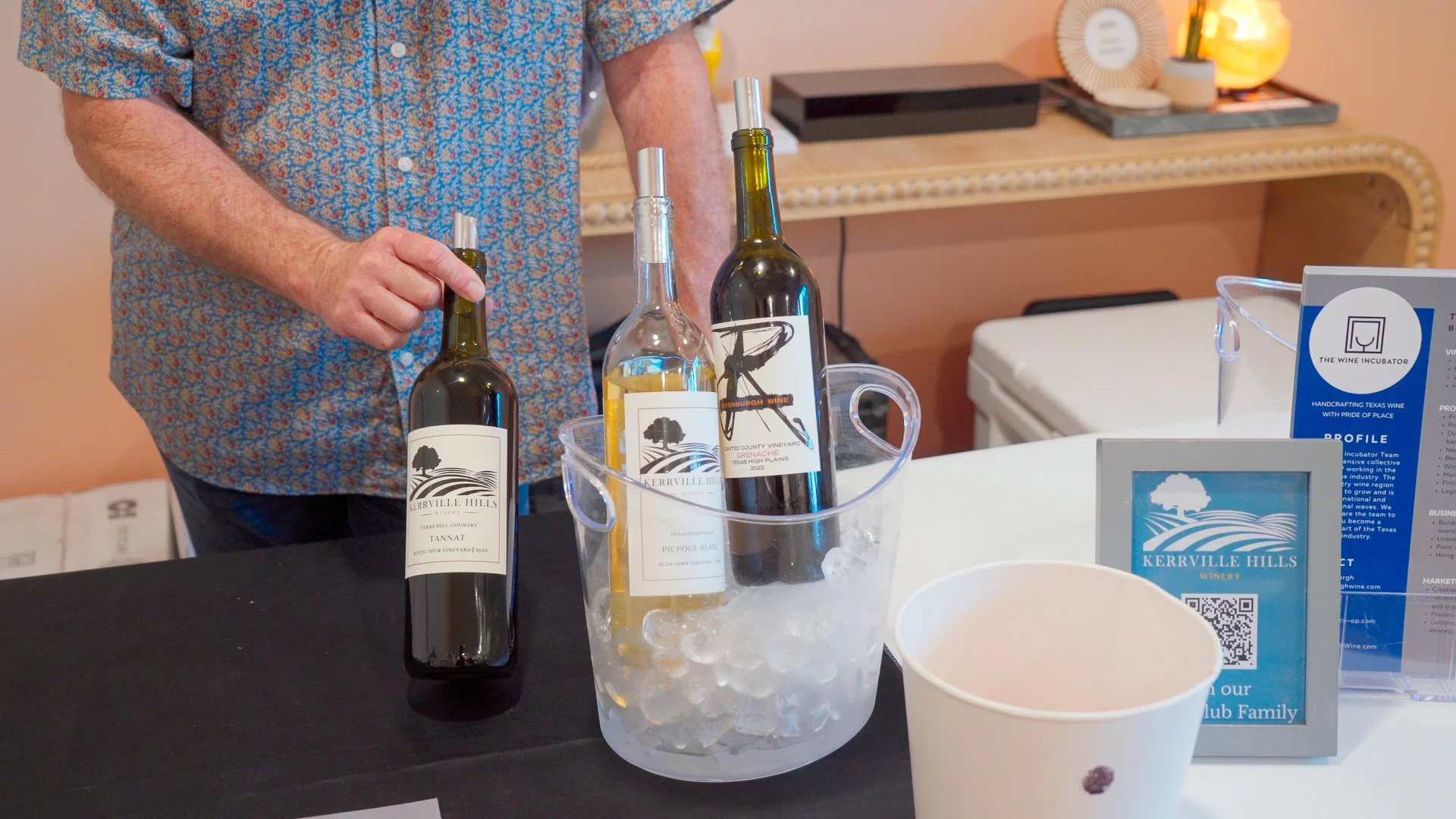  Winery tasting station set up inside Guad Haus for the Texas Wine Experience community event. 