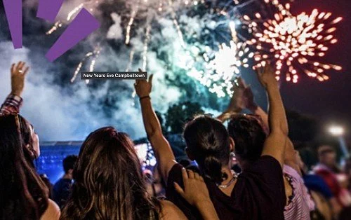 People celebrating New Year's Eve with fireworks display in the sky at Campbell Town. This is for Campbelltown NYE at Koshigaya Park