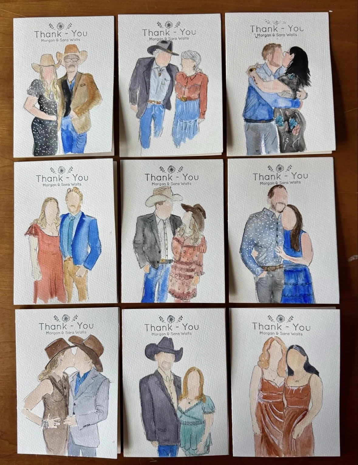 Nine handmade thank you cards featuring watercolor illustrations of couples in various outfits and poses, with the text 'Thank You' and 'Morgan & Sara Watts' on each card, arranged on a wooden surface.
