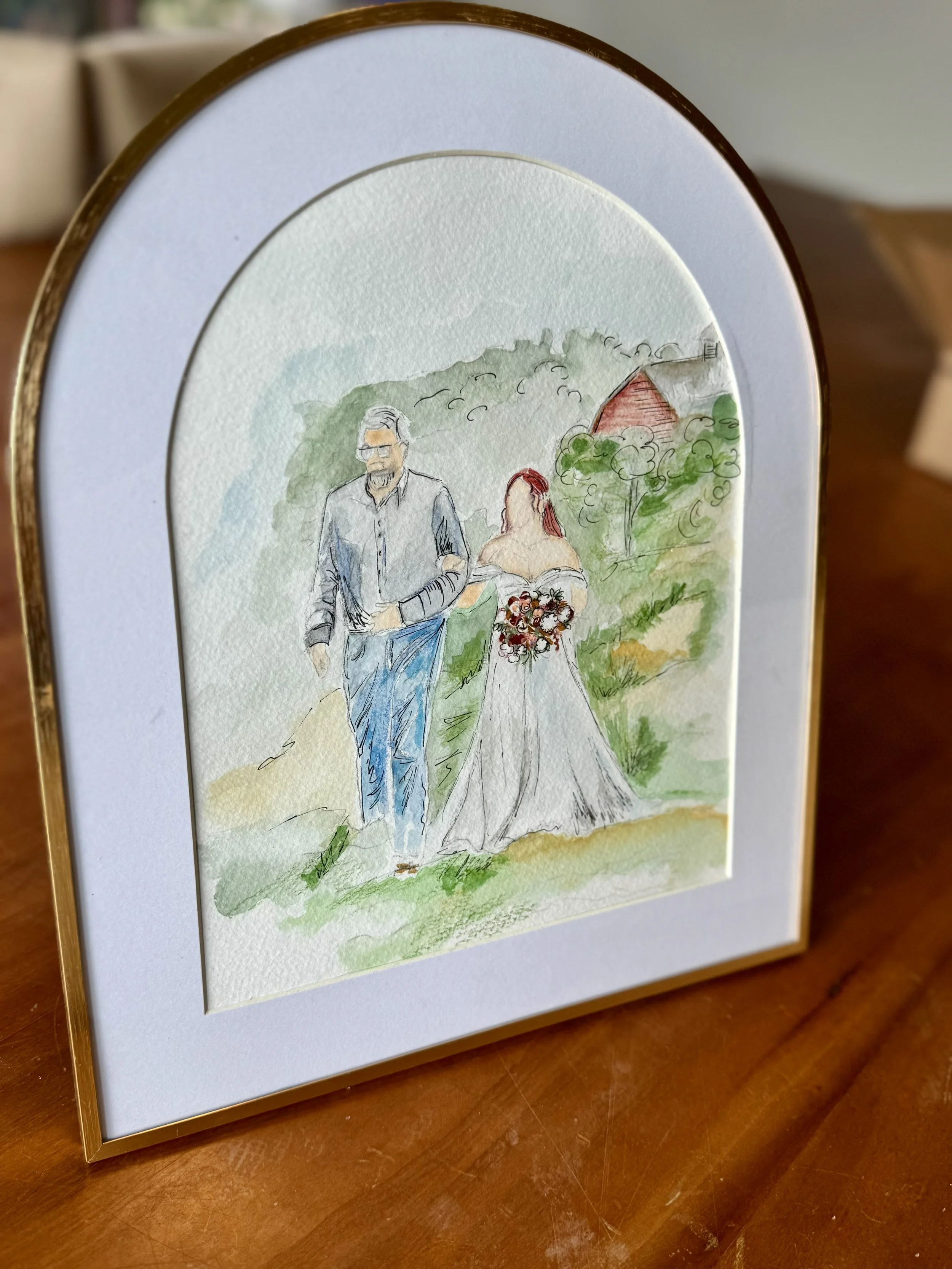 Watercolor painting of a bride and groom walking outdoors on a grassy path with trees and a red-roofed building in the background.