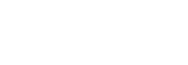 A close-up of a person holding a microphone, speaking into it.