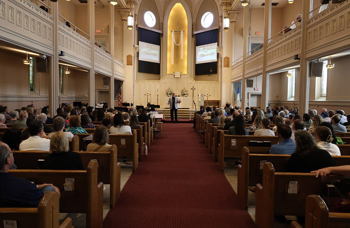 Immanuel Lutheran Church interior with a congregation of people facing the altar.