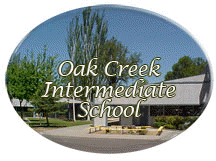 Sign for Oak Creek Intermediate School with trees and building in the background
