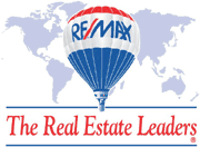 RE/MAX hot air balloon with world map background and the slogan 'The Real Estate Leaders'.