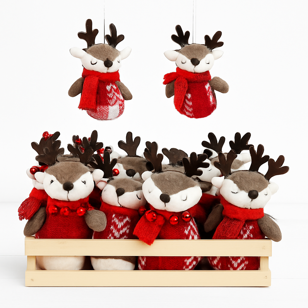Collection of plush reindeer toys dressed in red scarves and sweaters, some with antlers and jingle bells, arranged in a wooden box and hanging against a white background.