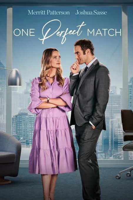 Poster for the movie 'One Perfect Match' featuring Merritt Patterson and Joshua Sasse standing in an office with city skyscrapers in the background. The woman is wearing a purple dress, and the man is in a gray suit, and they are looking at each other affectionately.