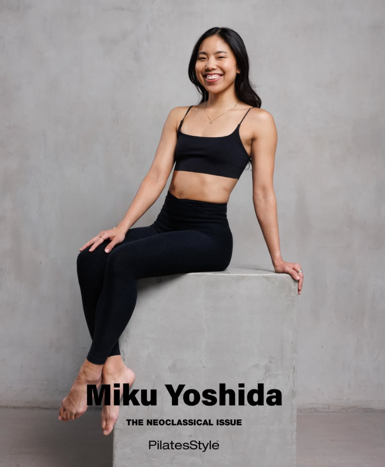 Portrait of a smiling woman with black hair in a black athletic outfit sitting on a concrete block against a plain gray background, with text 'Miku Yoshida, The Neoclassical Issue, PilatesStyle' at the bottom.