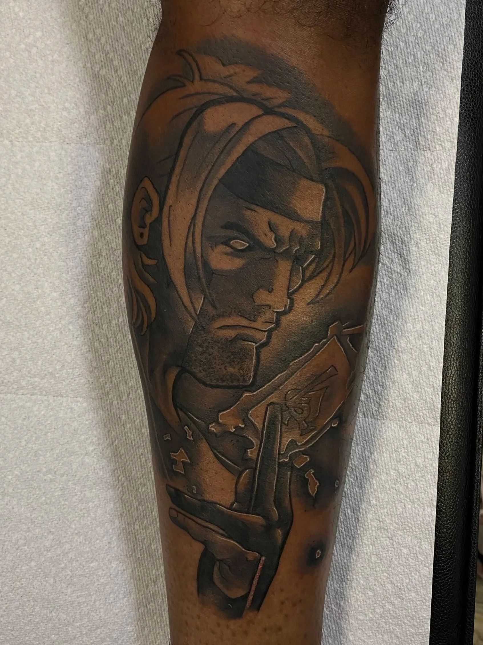 Gambit from X-Men, tattoo on leg