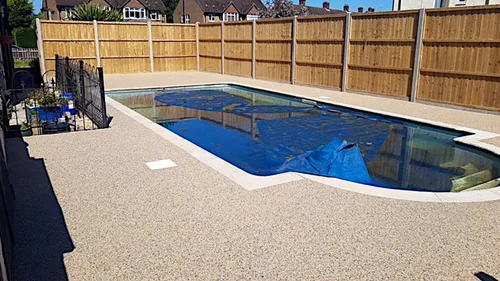 Surfacing around a swimming pool