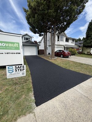 Driveway beside a lawn