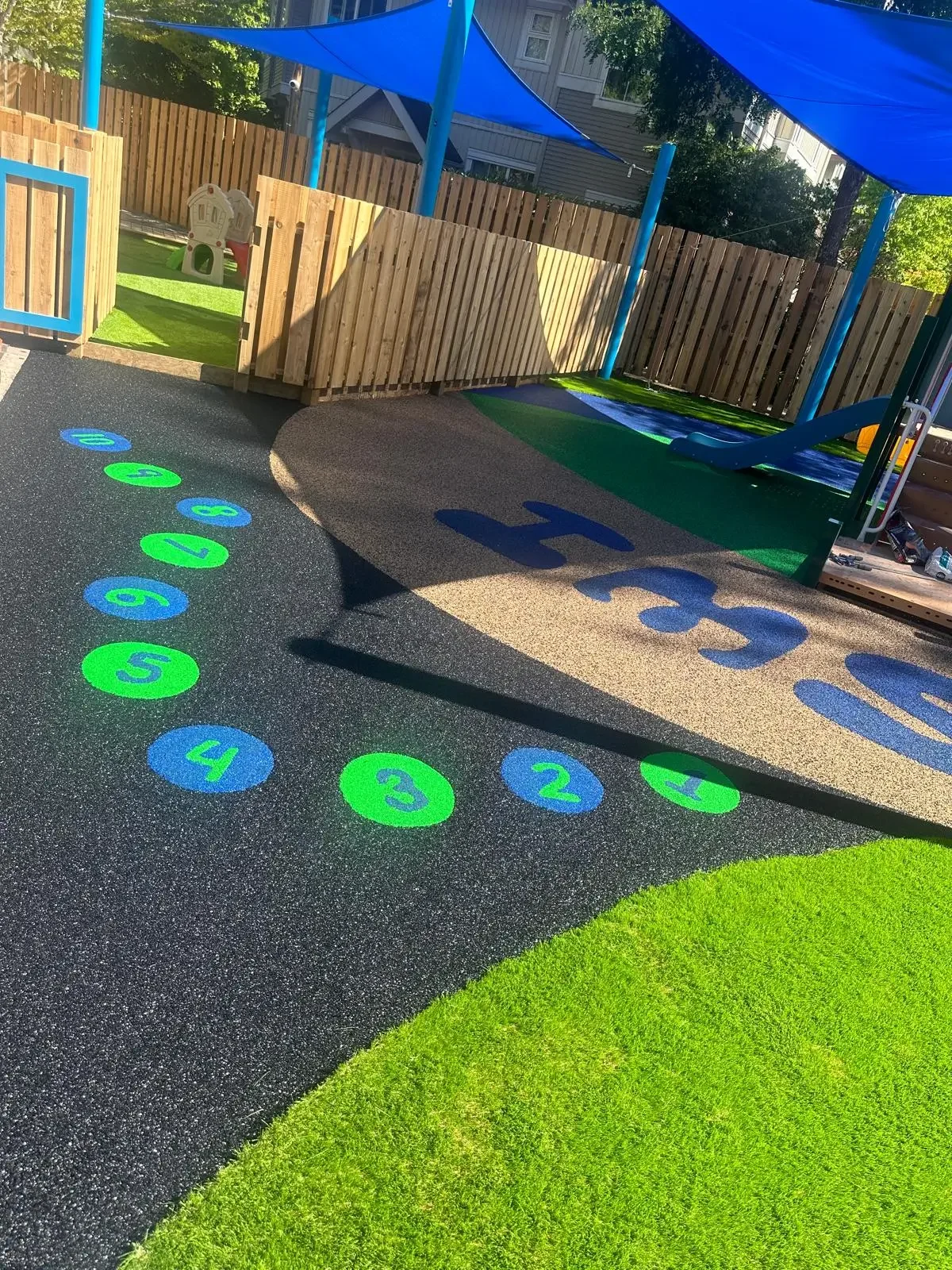Colourful poured-in-place rubber surfacing