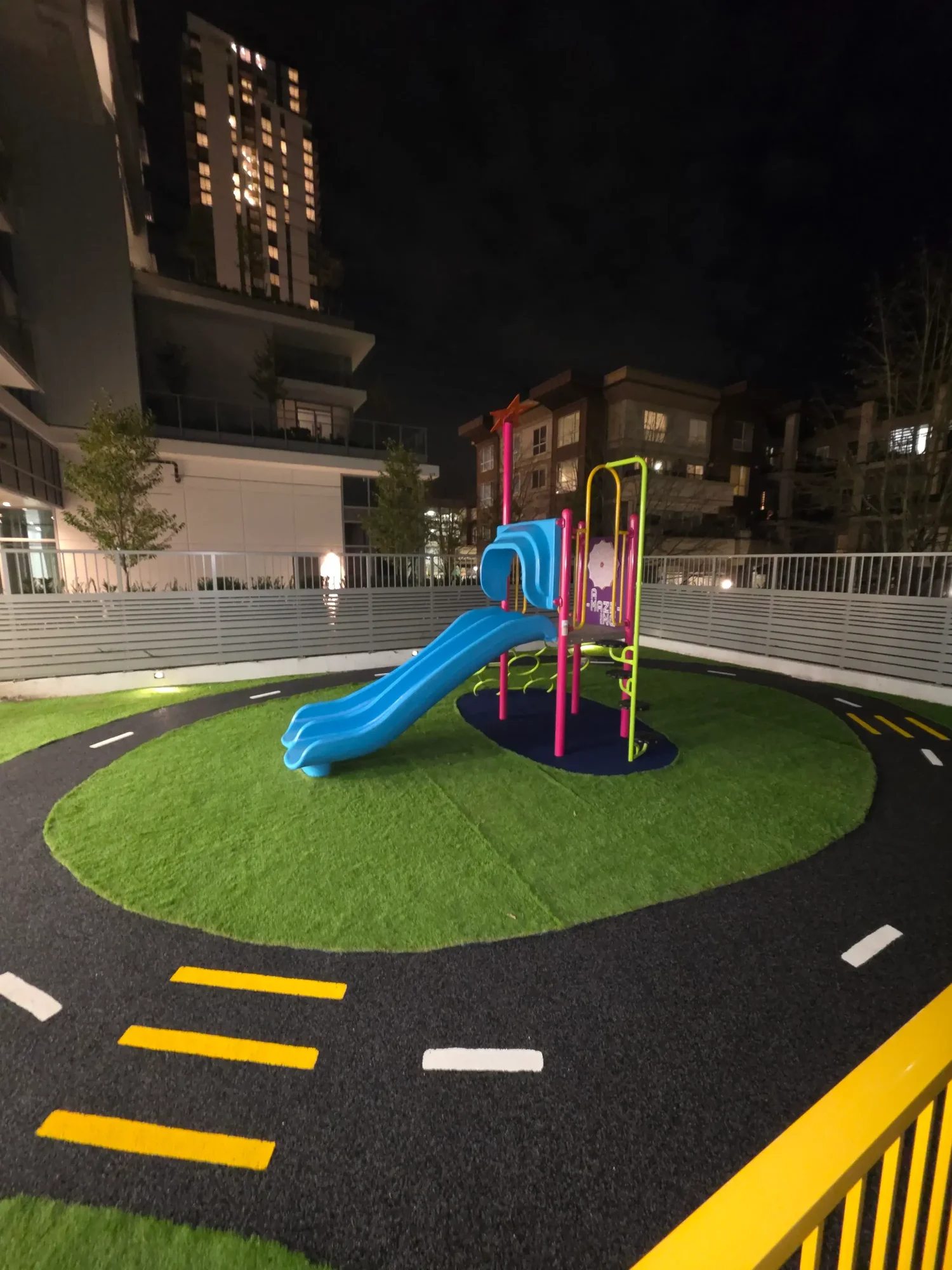 Safe Step Surfacing daycare playground installation with colourful play equipment and patterned rubber surfacing