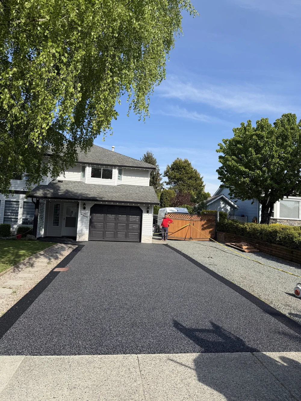 Dark rubber driveway with a contrasting border