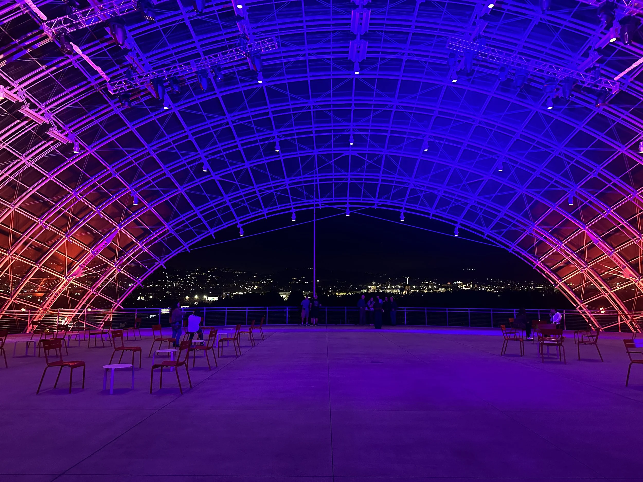 Photo of an archway at night.