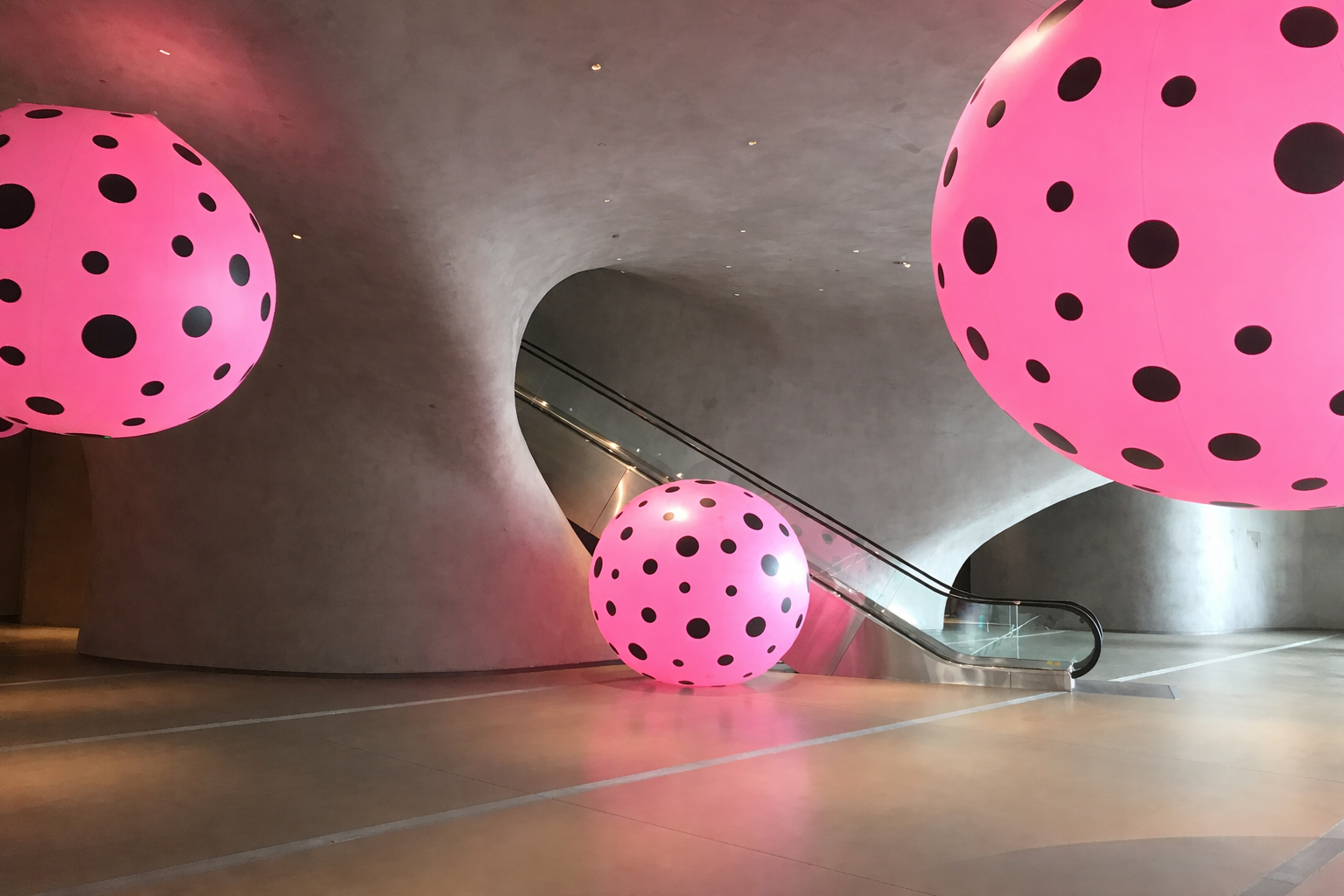 Art installation with pink spheres with polka dots; Los Angeles Broad Museum; contemporary art.