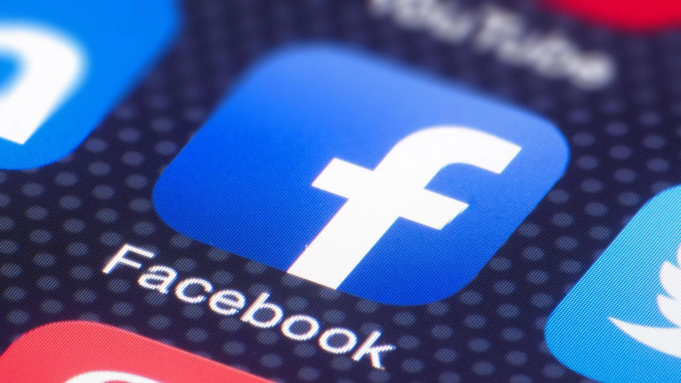 Close-up of a Facebook app icon on a smartphone screen.