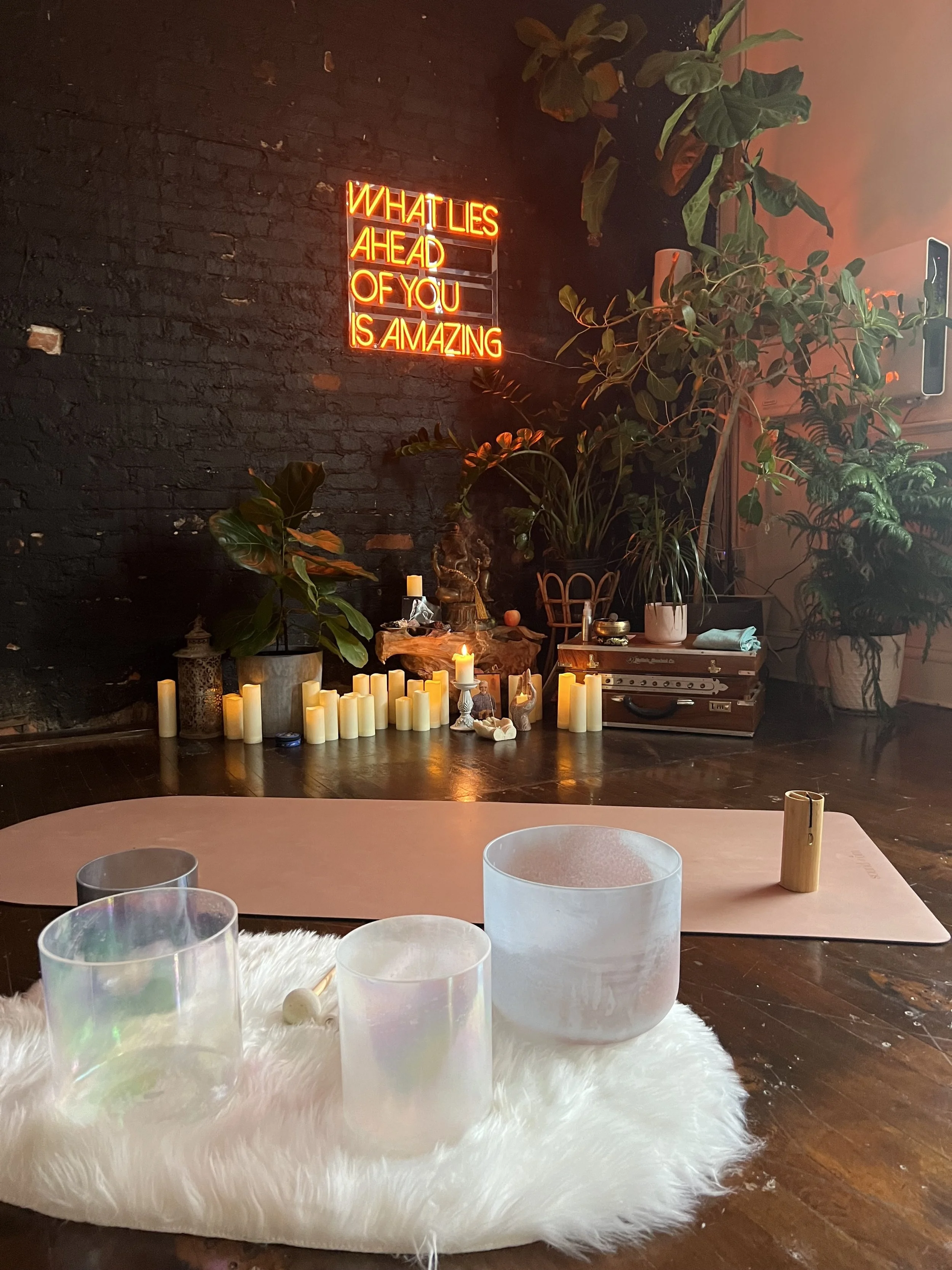 Candle-lit altar setup used during cacao ceremony