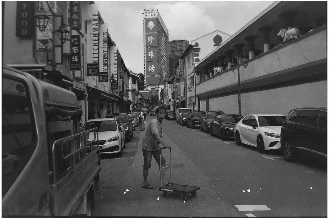 Singapore, Dec 2025.

Walking through markets, hawkers and side streets. 

Shot on Delta 400, pushed to 800.
Developed and scanned at home.