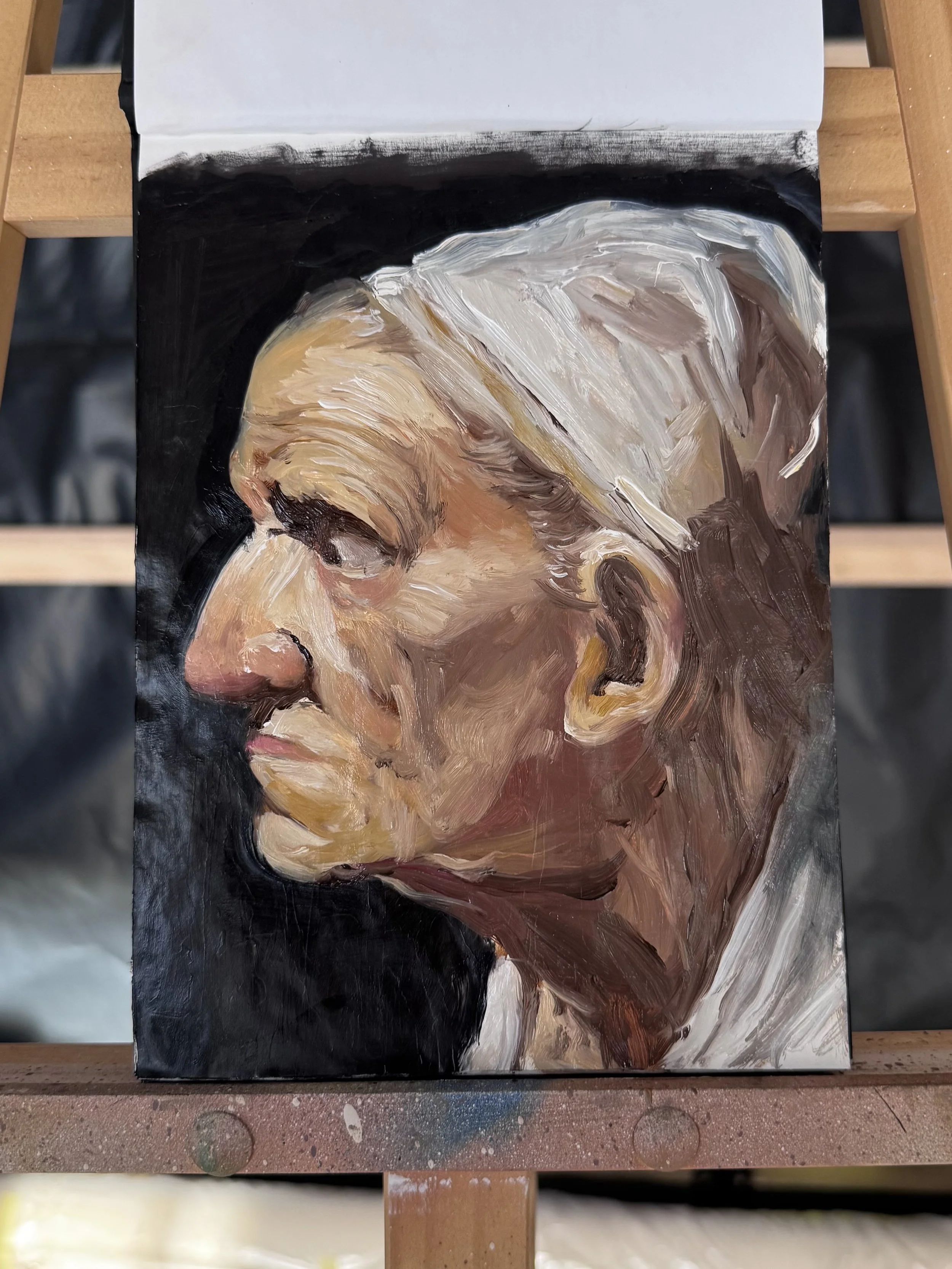 A painted portrait of an elderly person's side profile, showing detailed facial features including wrinkles, closed eyes, and white hair with a dark background.