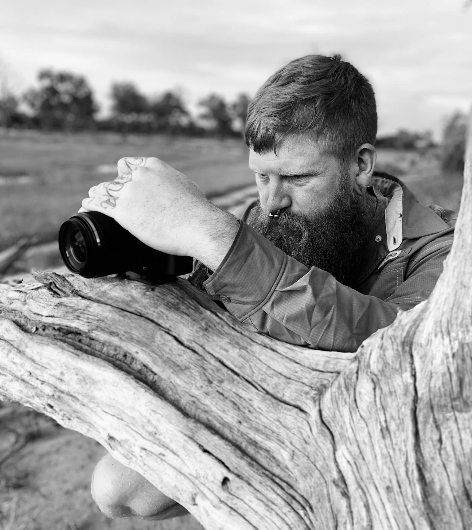 David photographing wildlife from a fallen down tree in Botswana.