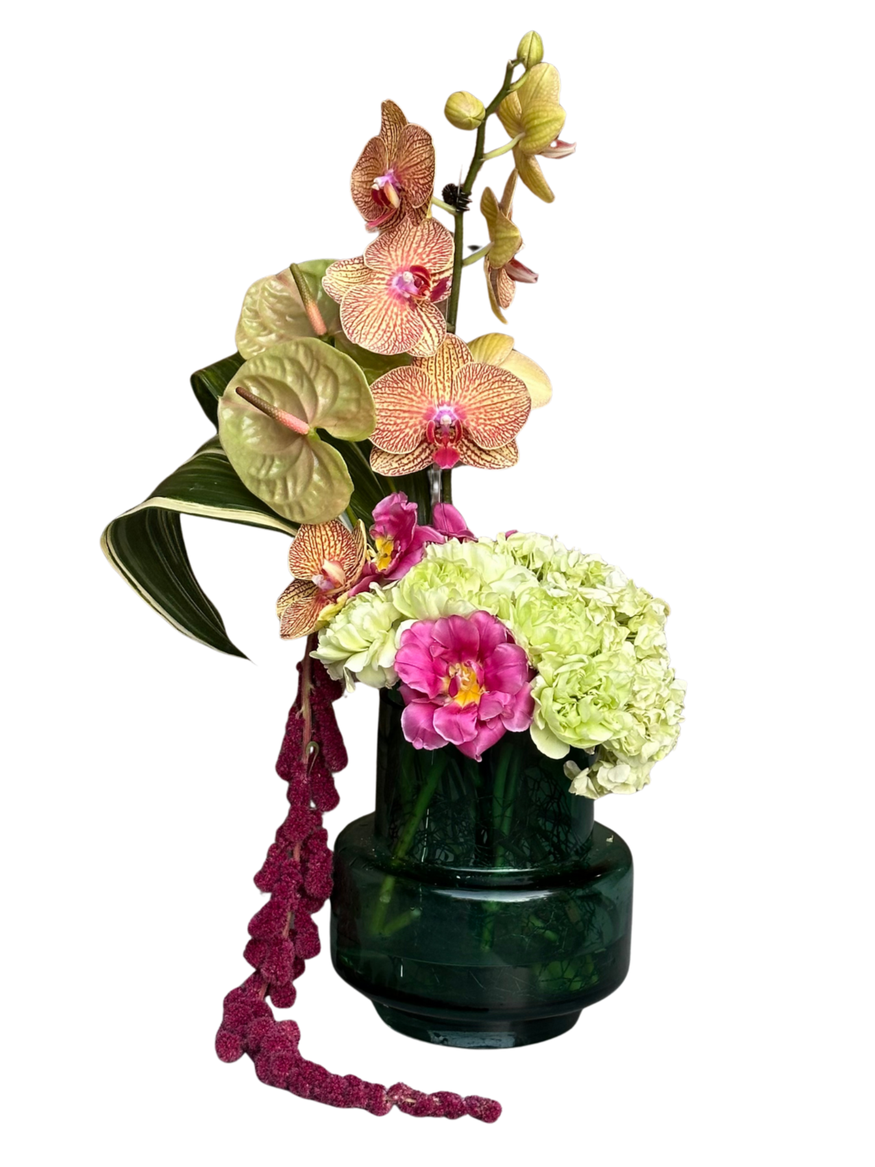 A vibrant bouquet of flowers in a dark green vase, featuring pink, white, and peach orchids, hydrangeas, and a trailing amaranthus.