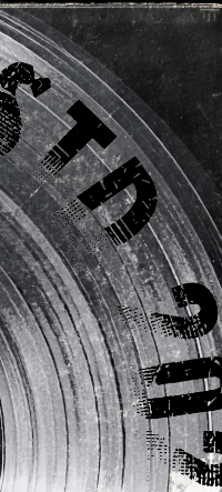 Close-up of a clock face with black hour and minute hands, and bold black numbers marking hours.