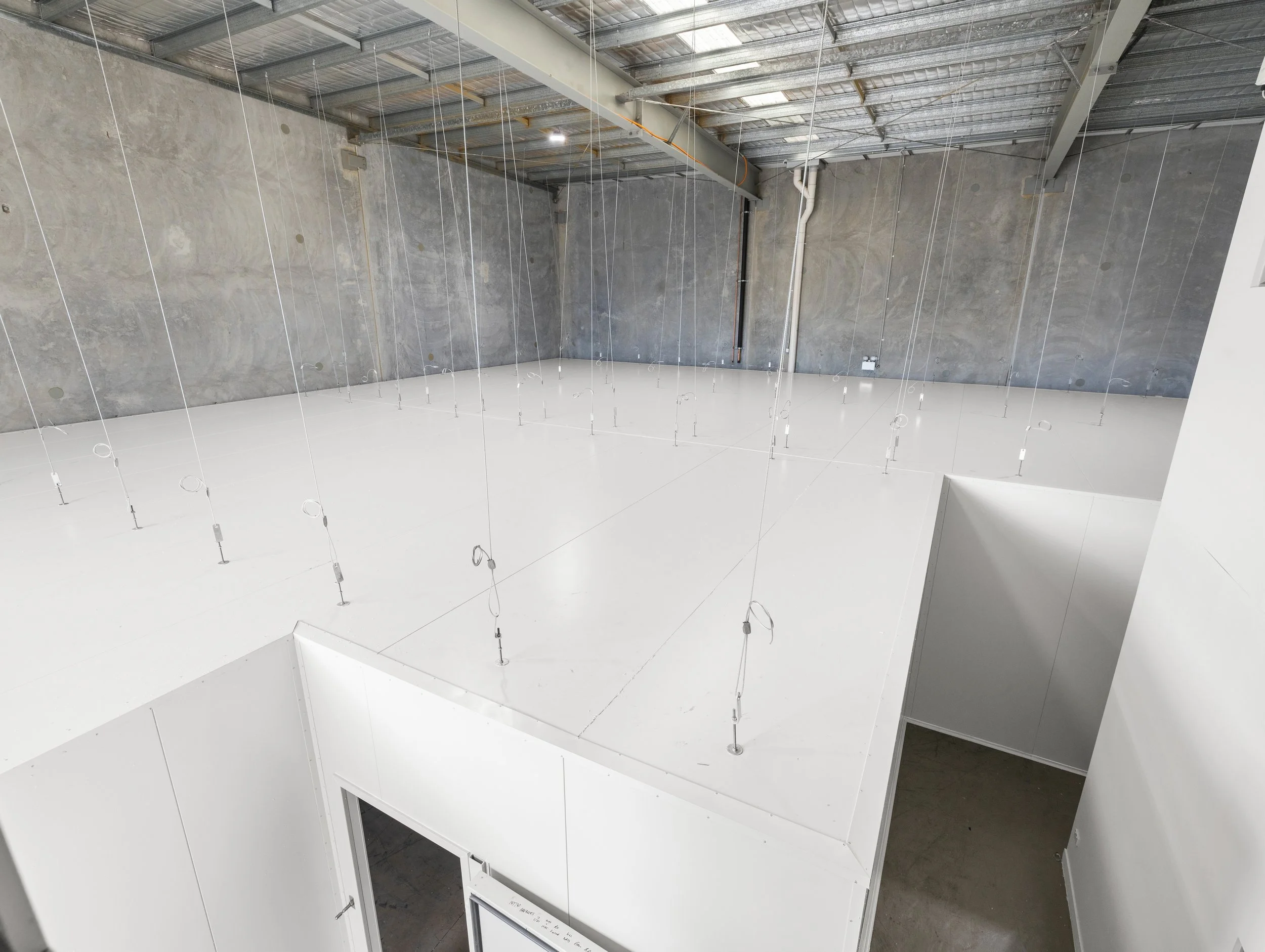Brisbane City Cold Room Installed by WYPI Building & Service at Brubecks Boutique Foods cold room showcasing how the roof is attached suspended by large thick metal cables