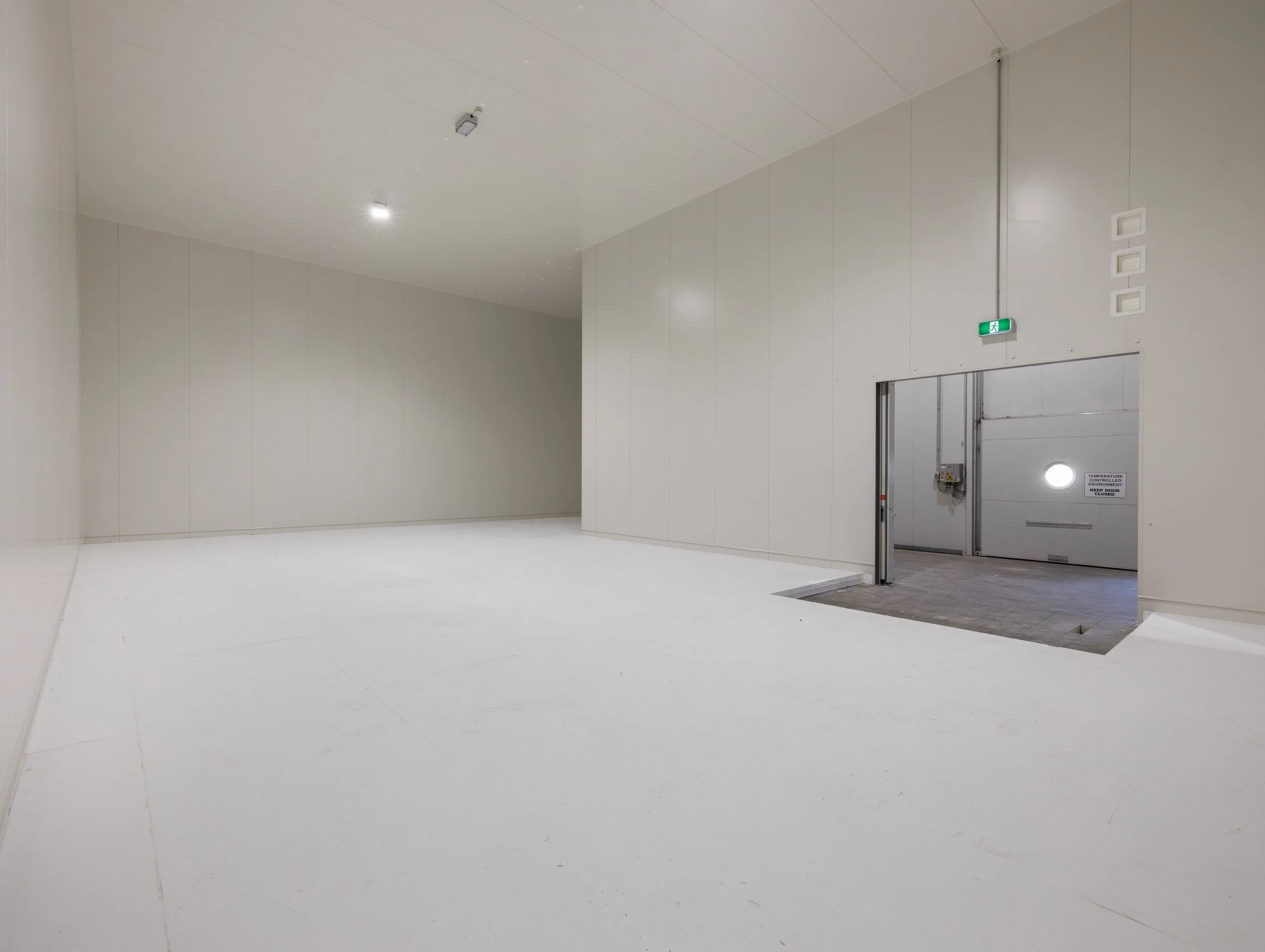 Brisbane City, Cold Room Installed by WYPI Building & Service at The Snack Food finished panel install with new sliding door