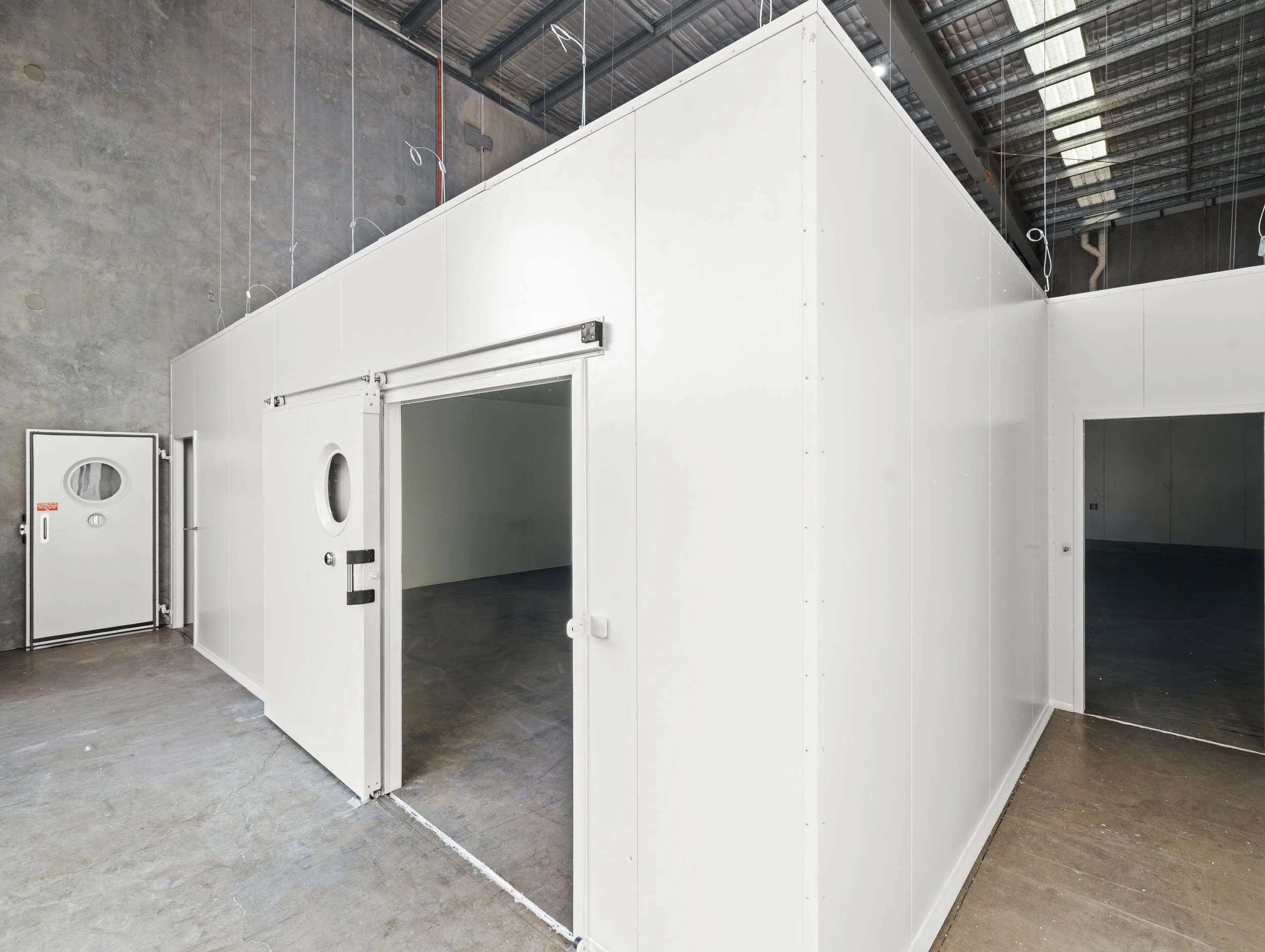 Brisbane City Cold Room Installed by WYPI Building & Service at Brubecks Boutique Foods front with all doors open showcasing inside off cold room