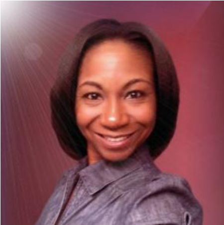 A woman smiling with shoulder-length dark hair, wearing a gray top, against a pinkish background with light flare effects.