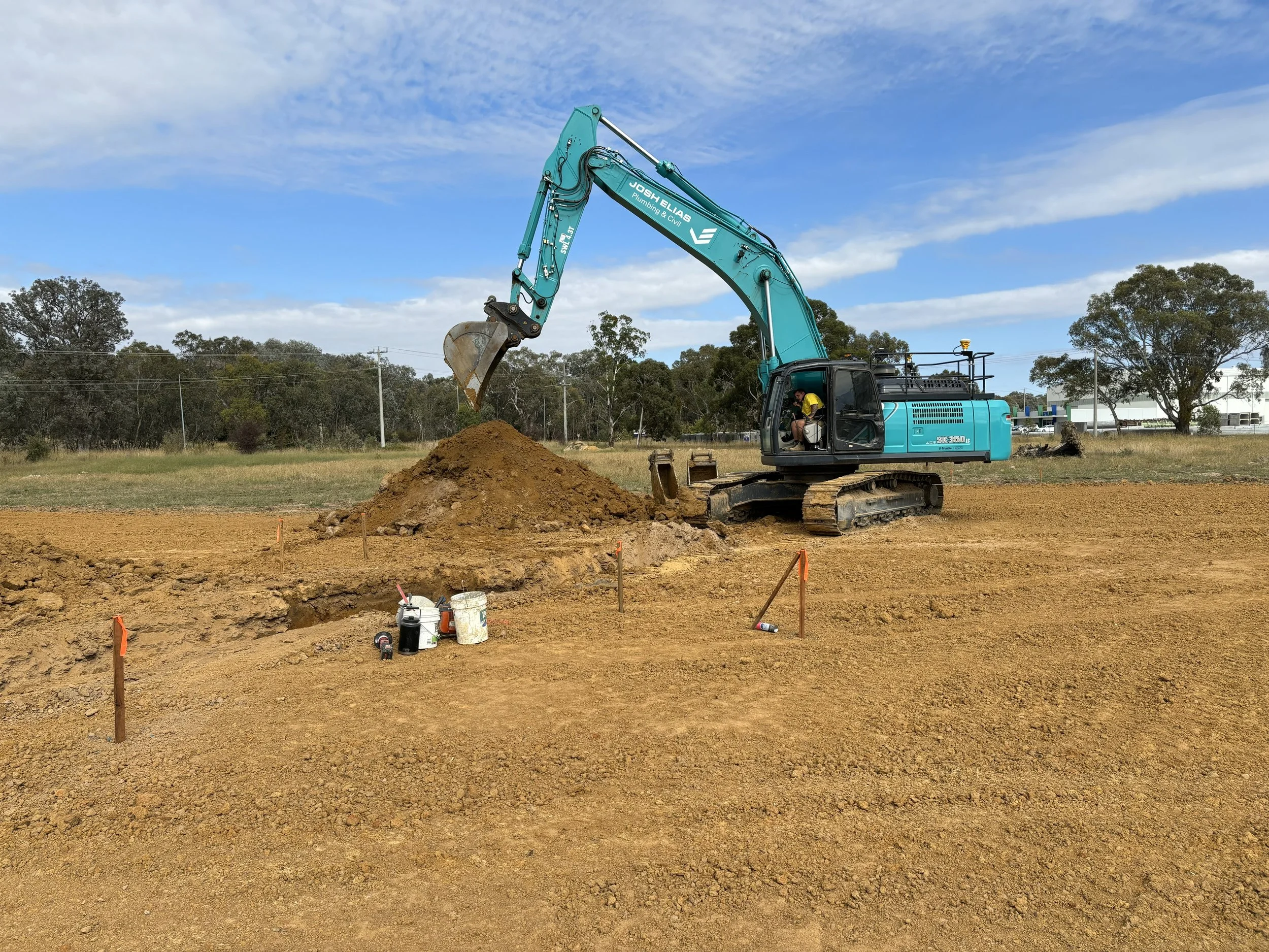 JEPC excavator digging soil at a construction site 