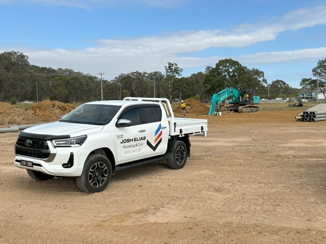 JEPC utility truck parked on a construction site.