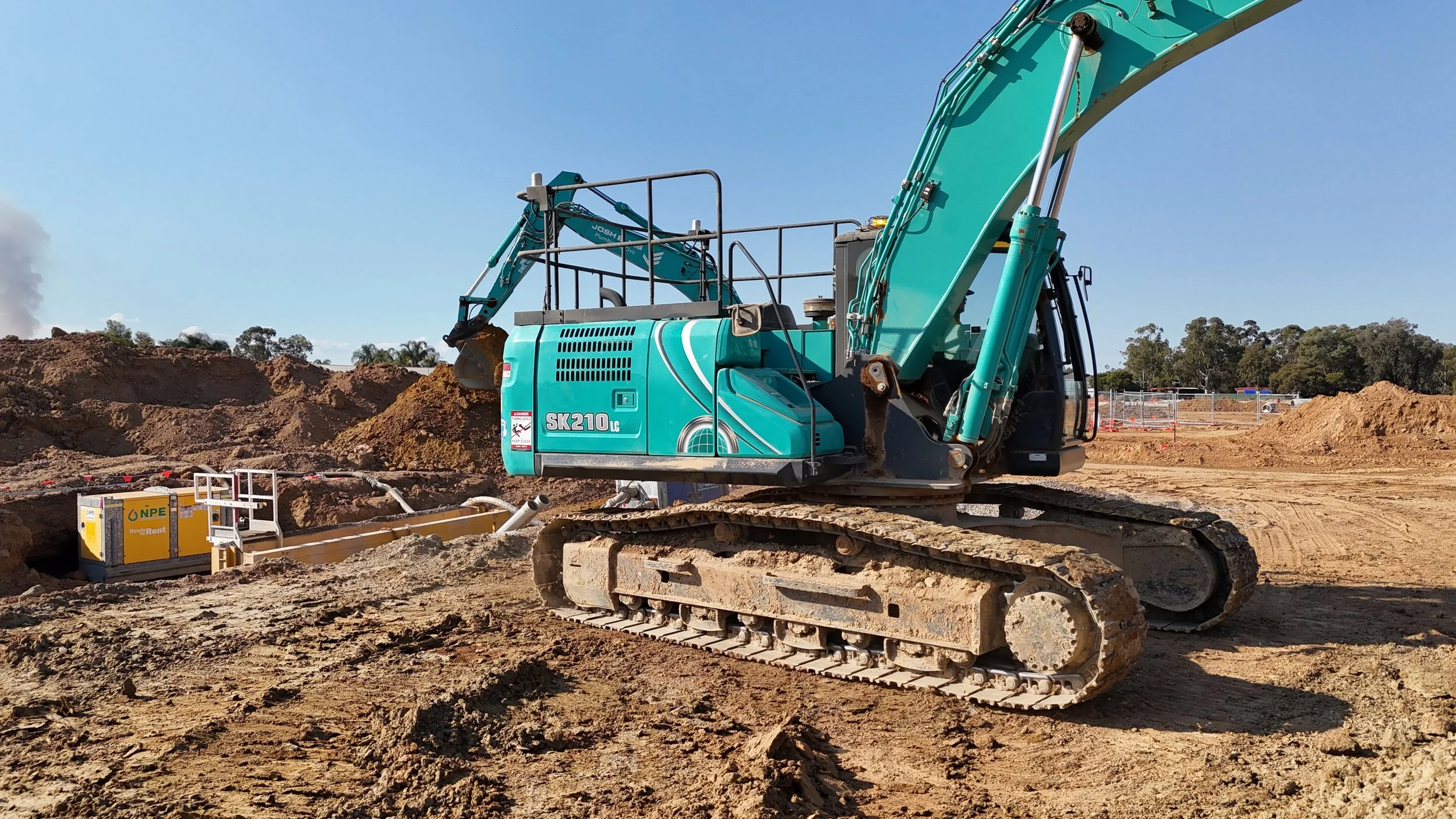 JEPC hydraulic excavator on a construction site with dirt and soil