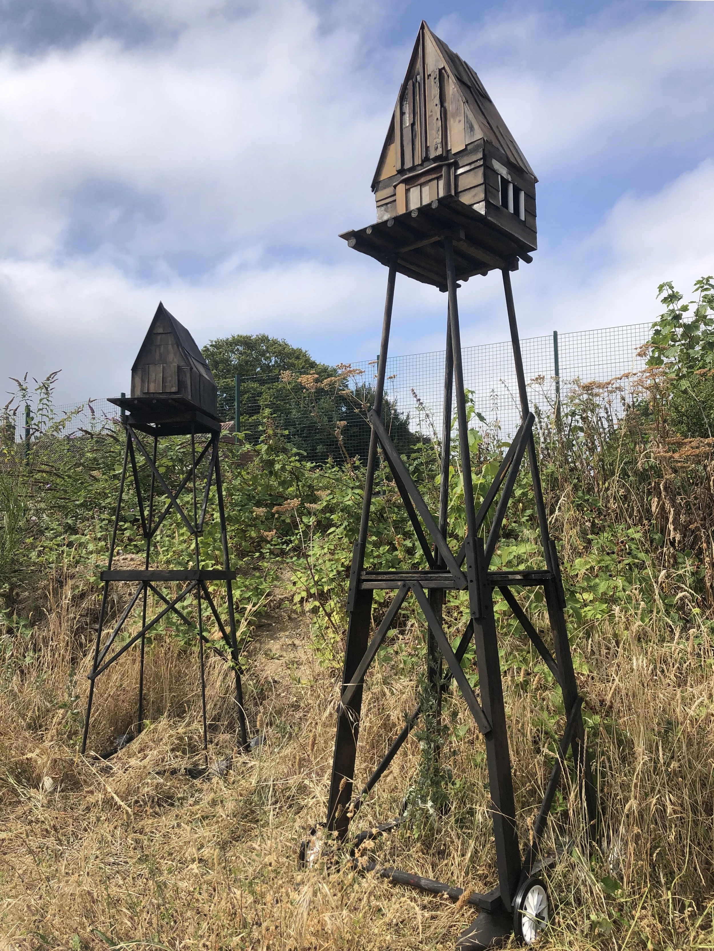  Towers  (from  St. Martin's Land  series), wood, plastic, 260 x 80 x 85cm & 220 x 80 x 80cm