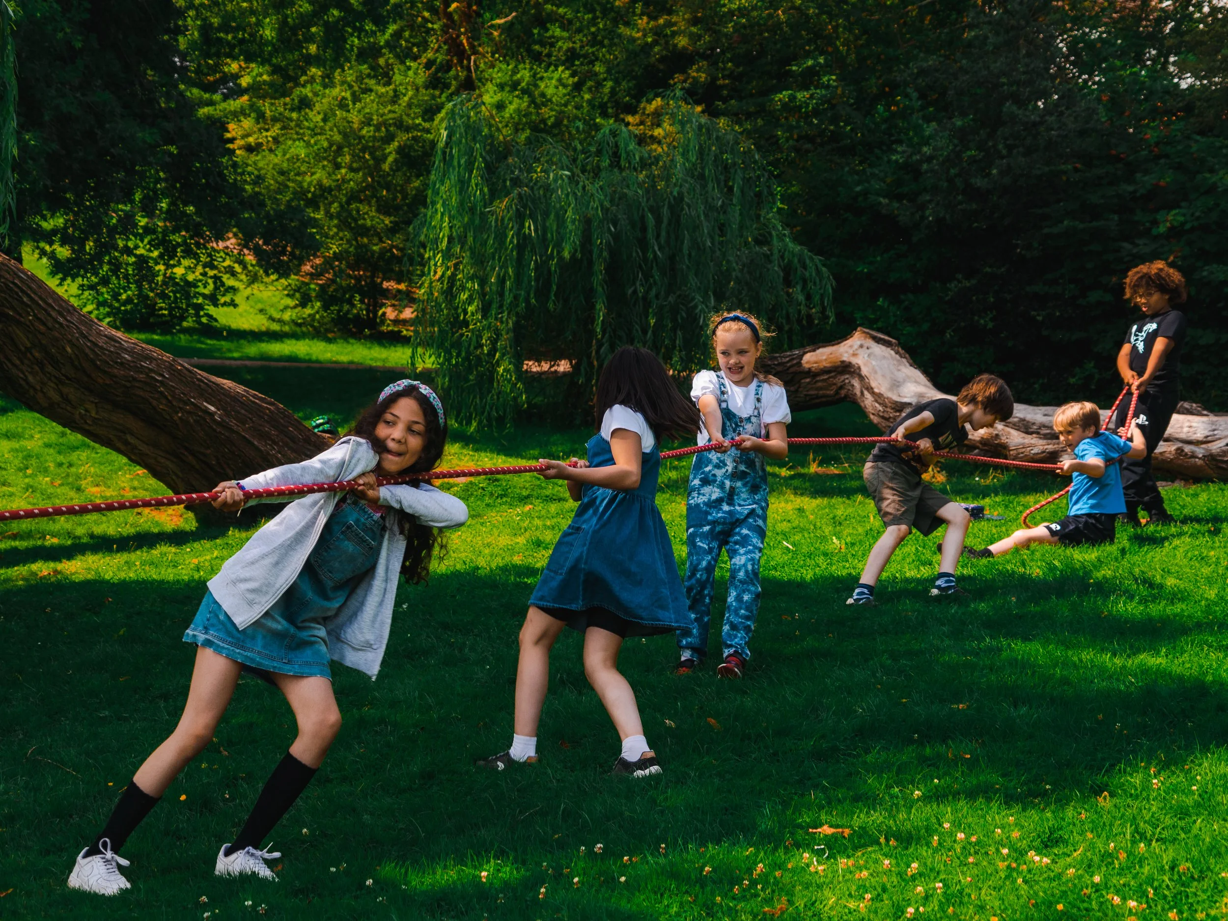 Children enjoying a game of tug-of-war at Global Camps