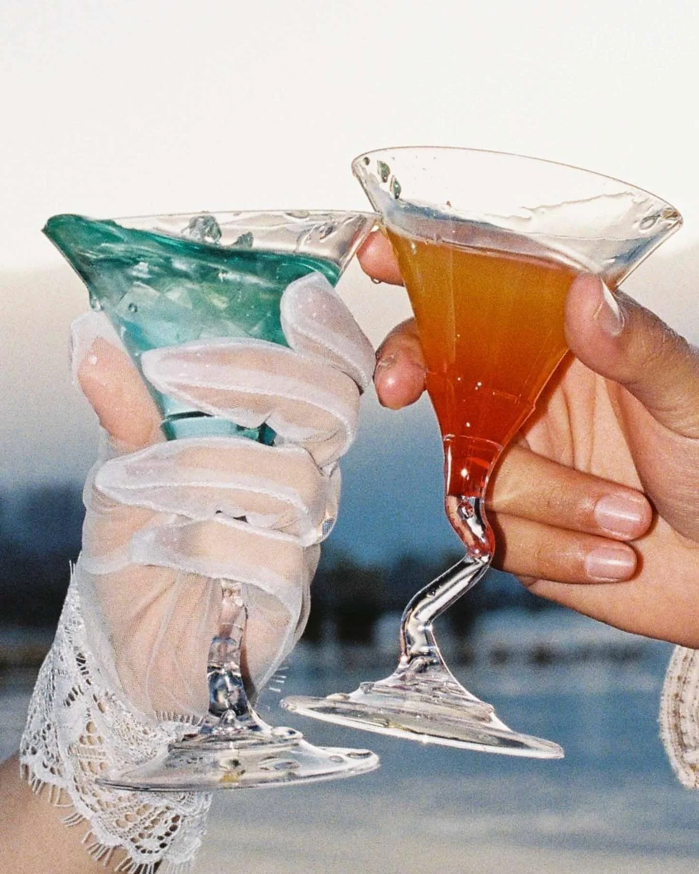 A toast to color, laughter, and sunlit joy&mdash; capturing a moment where every clink was pure delight.